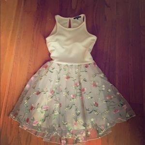 Girls Cream dress with pink and green flowers.